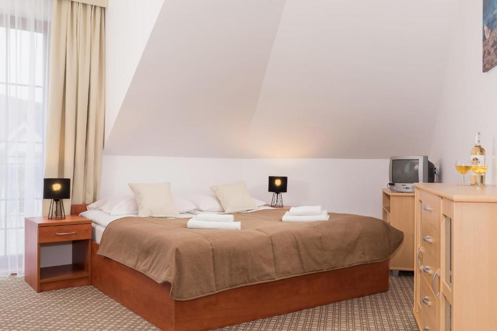 Ein Bett oder Betten in einem Zimmer der Unterkunft Willa Arielka