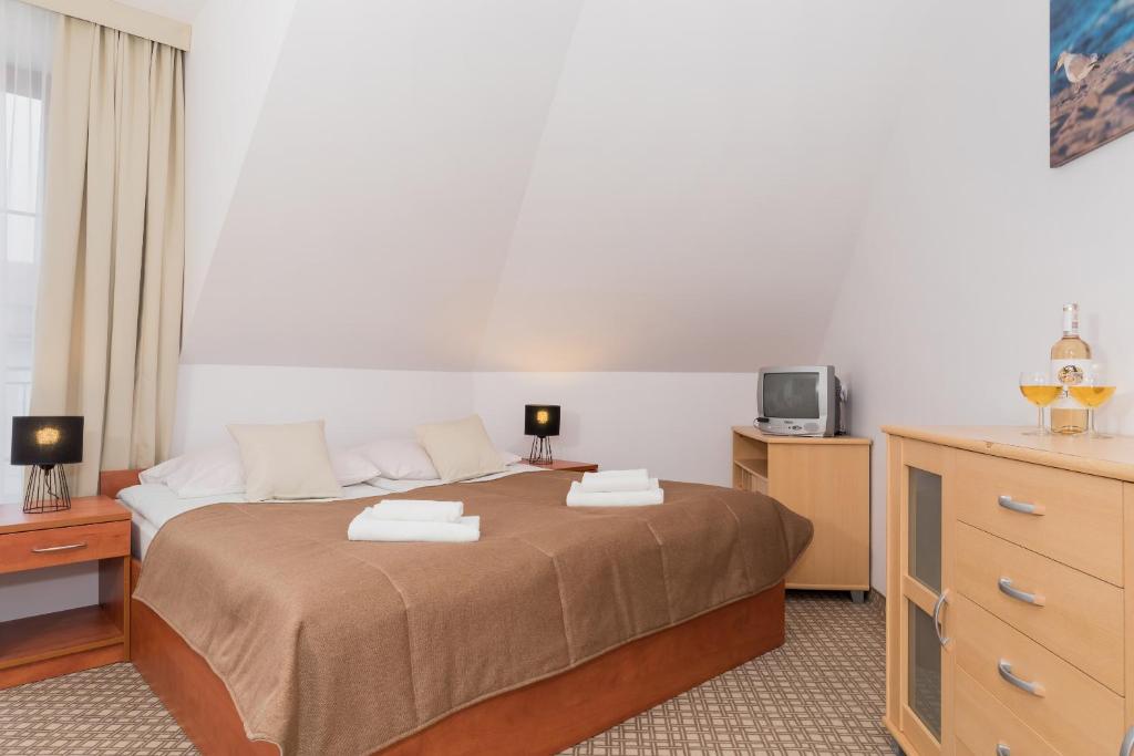 Ein Bett oder Betten in einem Zimmer der Unterkunft Willa Arielka