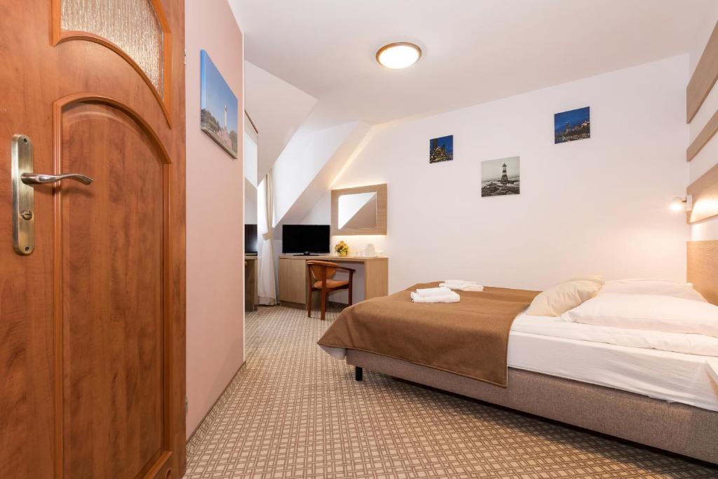 Ein Bett oder Betten in einem Zimmer der Unterkunft Willa Arielka