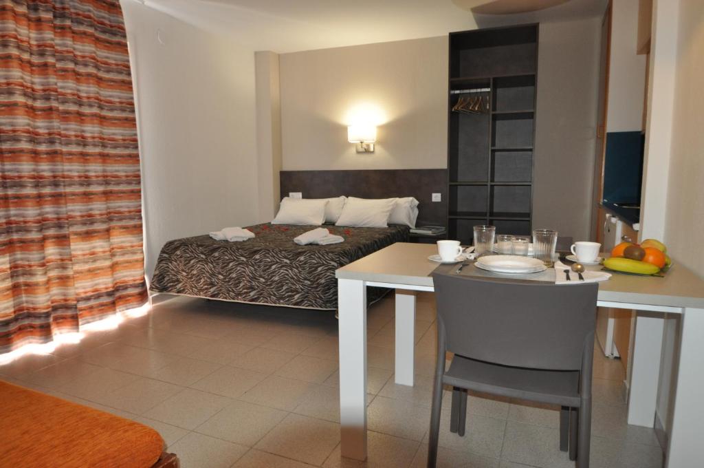 Postel nebo postele na pokoji v ubytování Aparthotel Safari