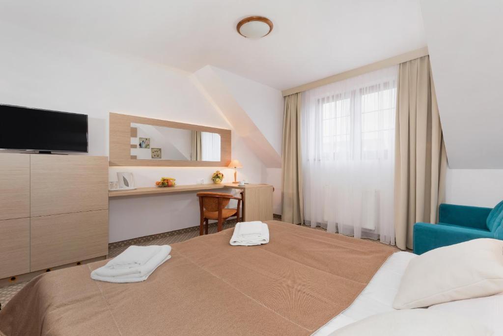 Ein Bett oder Betten in einem Zimmer der Unterkunft Willa Arielka