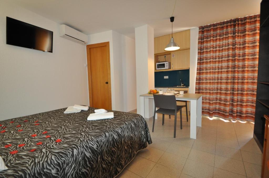 Postel nebo postele na pokoji v ubytování Aparthotel Safari