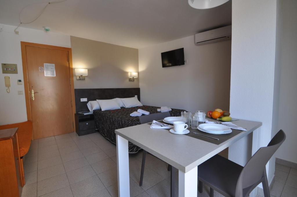 Postel nebo postele na pokoji v ubytování Aparthotel Safari