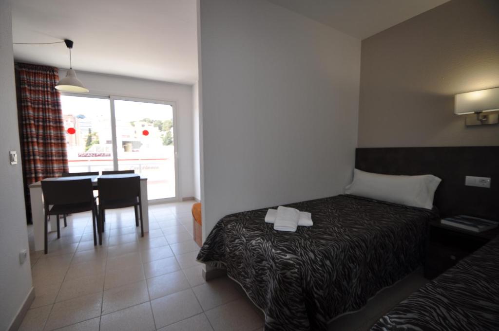 Postel nebo postele na pokoji v ubytování Aparthotel Safari