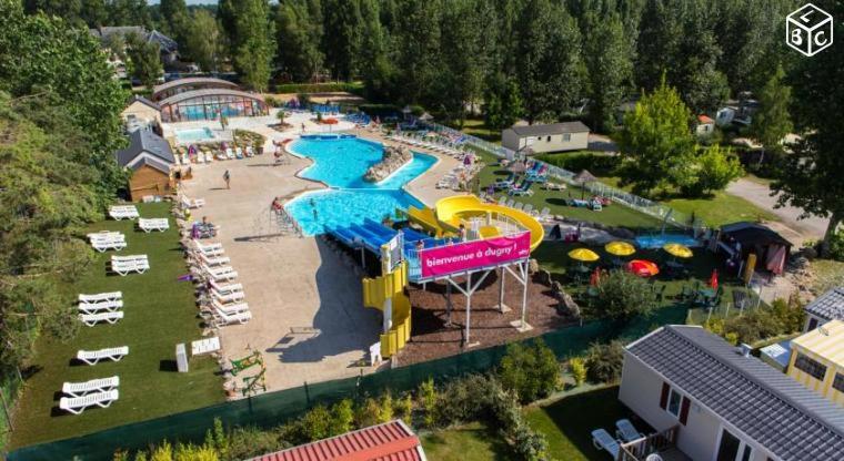 an aerial view of a water park with a water slide at Dugny-Mobil home in Onzain