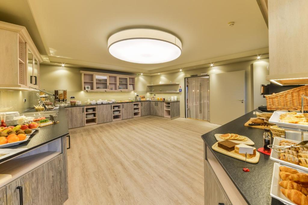 Kuchyň nebo kuchyňský kout v ubytování Hotel Schiller