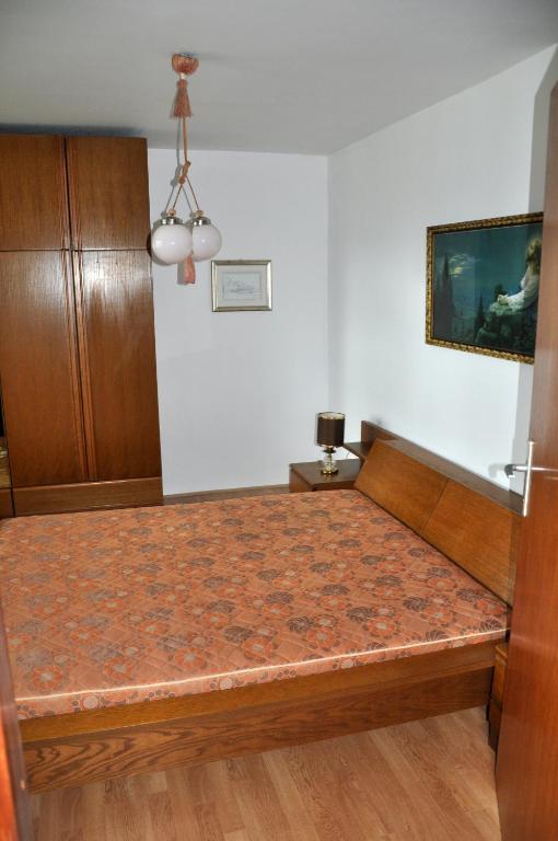 Postel nebo postele na pokoji v ubytování Apartments MM
