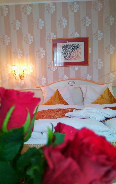 Postel nebo postele na pokoji v ubytování Alexa Hotel
