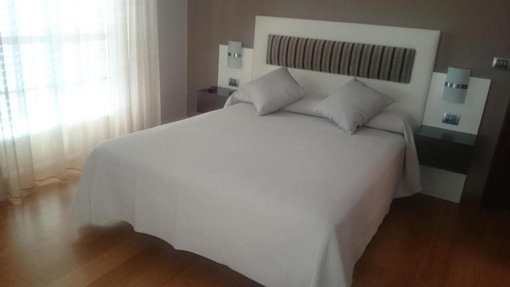 Posteľ alebo postele v izbe v ubytovaní Hotel El Millón
