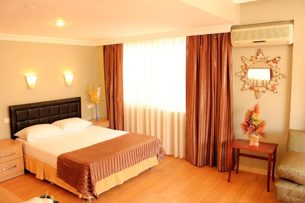 Postel nebo postele na pokoji v ubytování Hotel Dost
