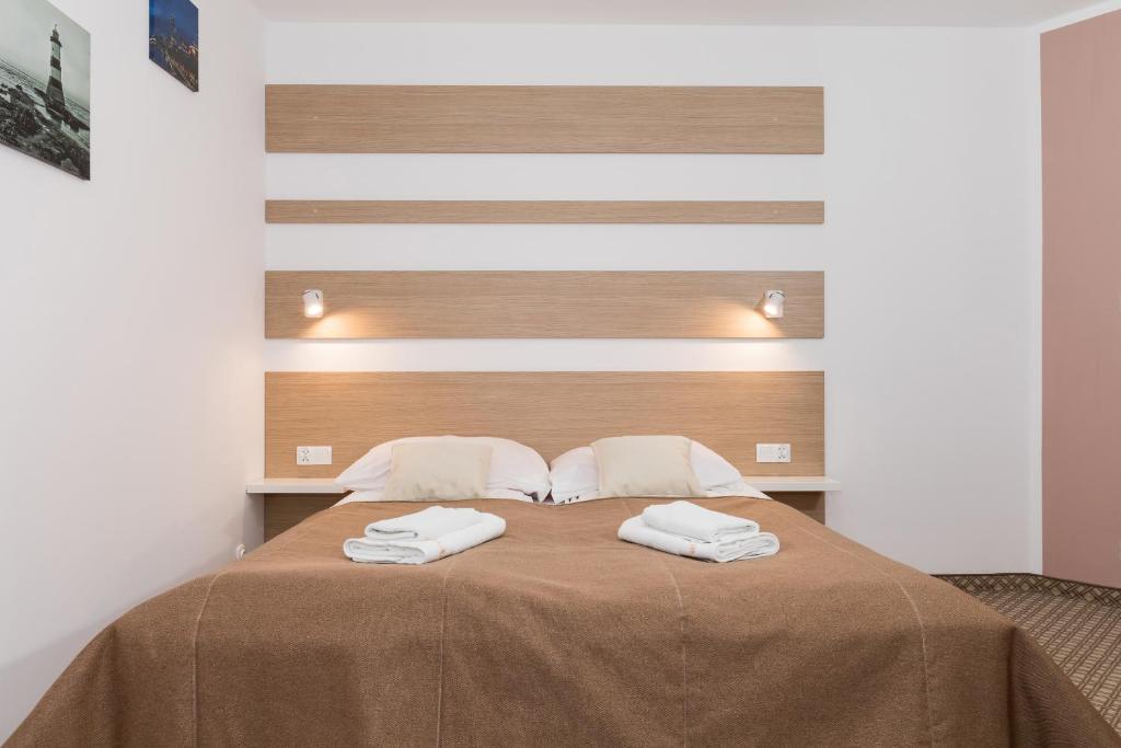 Ein Bett oder Betten in einem Zimmer der Unterkunft Willa Arielka