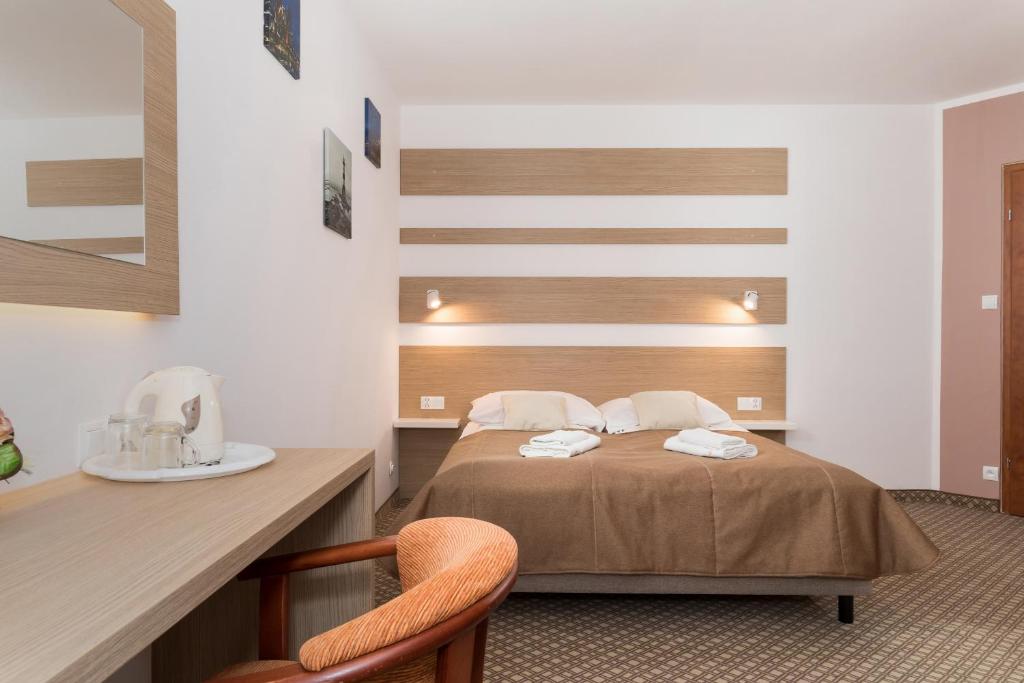 Ein Bett oder Betten in einem Zimmer der Unterkunft Willa Arielka