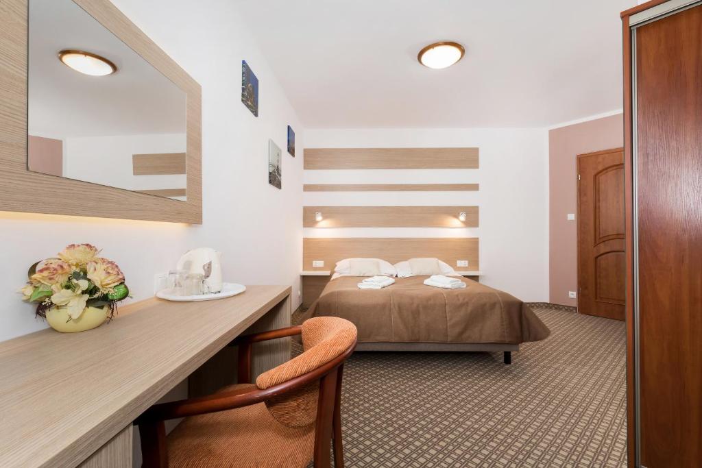 Ein Bett oder Betten in einem Zimmer der Unterkunft Willa Arielka