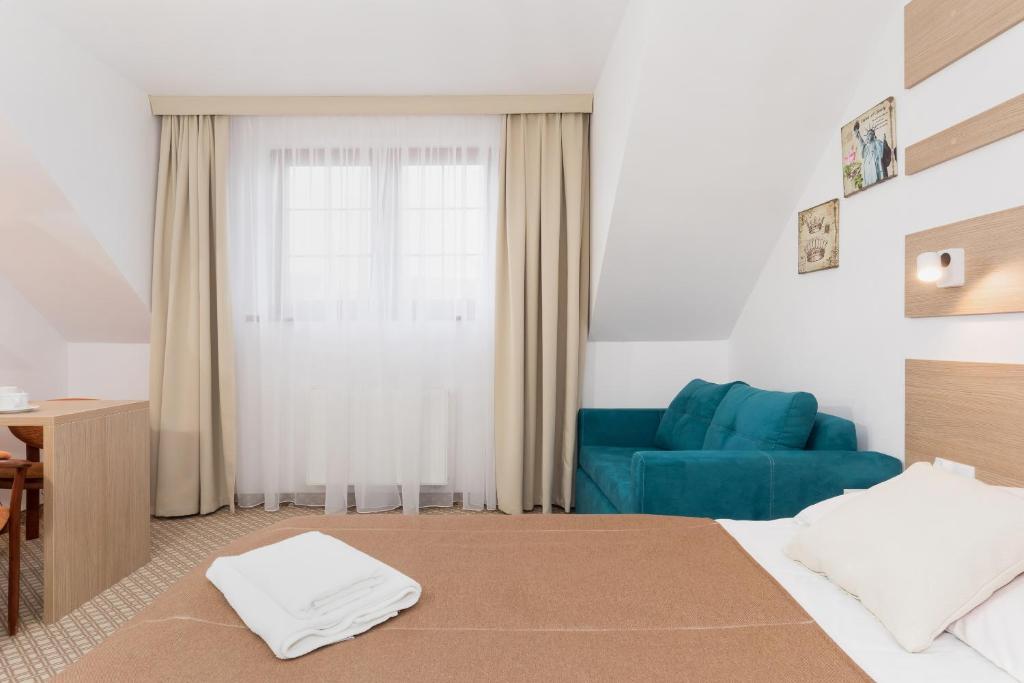 Ein Bett oder Betten in einem Zimmer der Unterkunft Willa Arielka