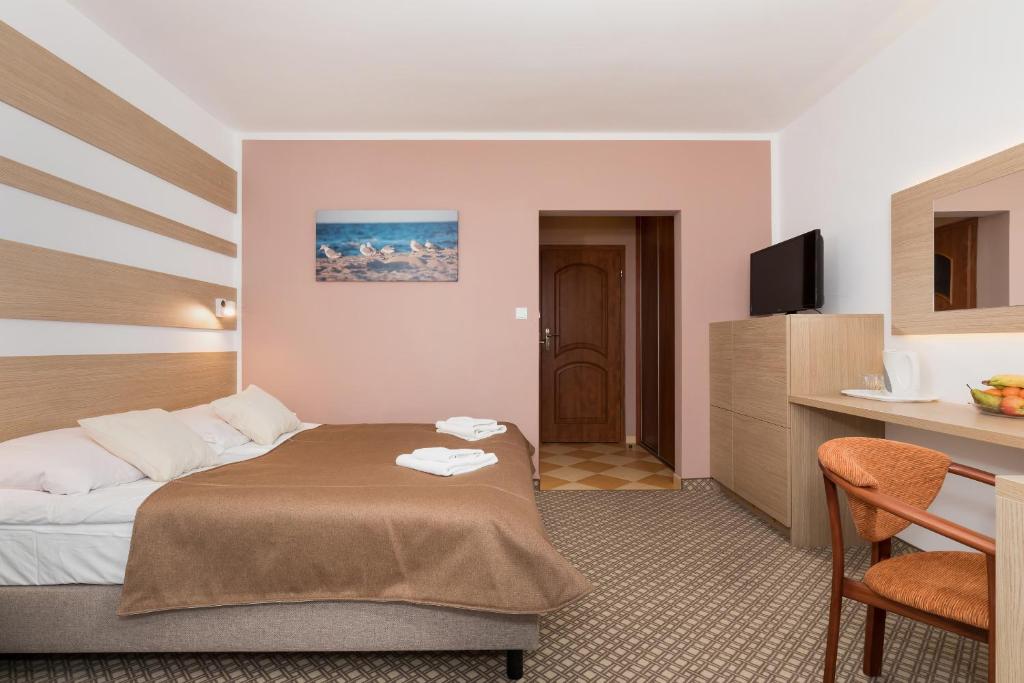 Ein Bett oder Betten in einem Zimmer der Unterkunft Willa Arielka
