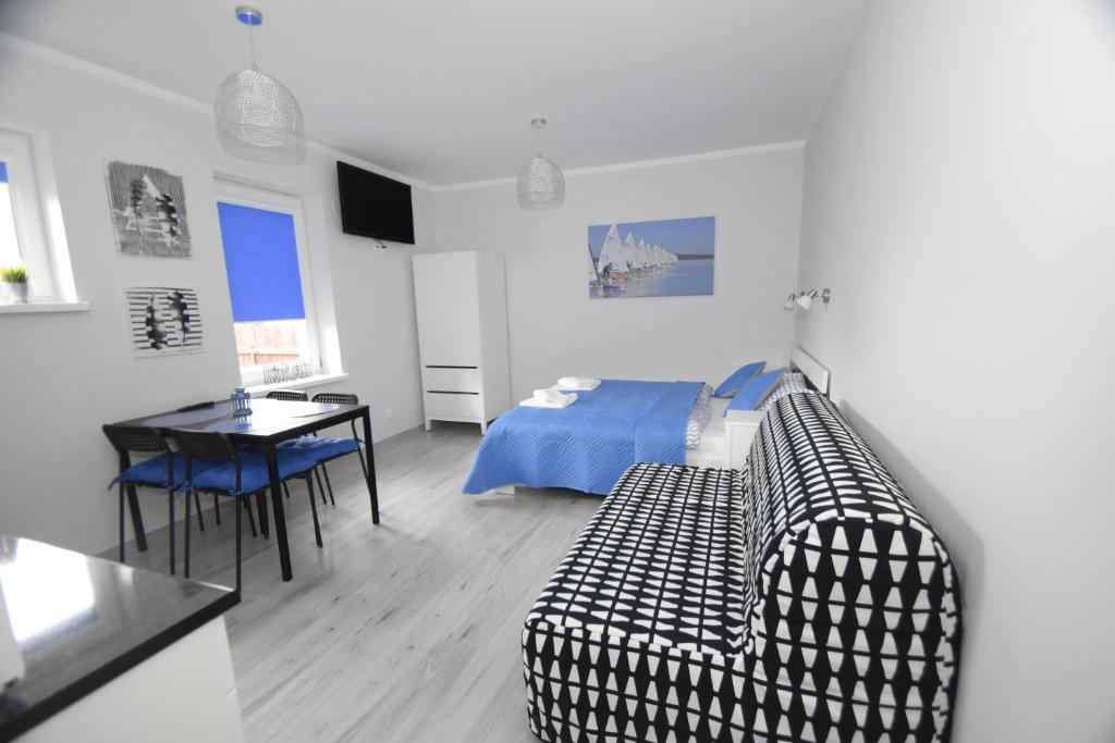 Posteľ alebo postele v izbe v ubytovaní Mazuria Apartamenty
