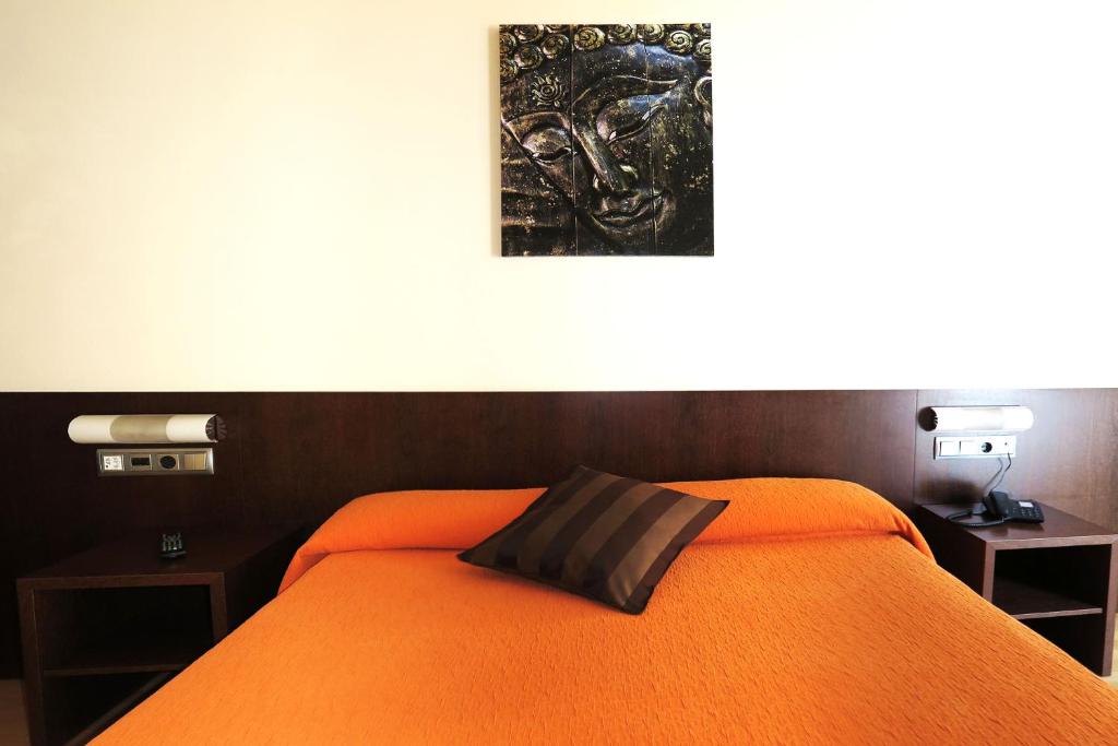 Postel nebo postele na pokoji v ubytování Hostal Nirvana