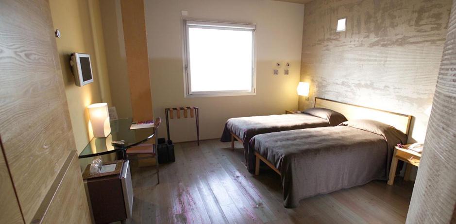 Postel nebo postele na pokoji v ubytování Albergo Cantine Ascheri