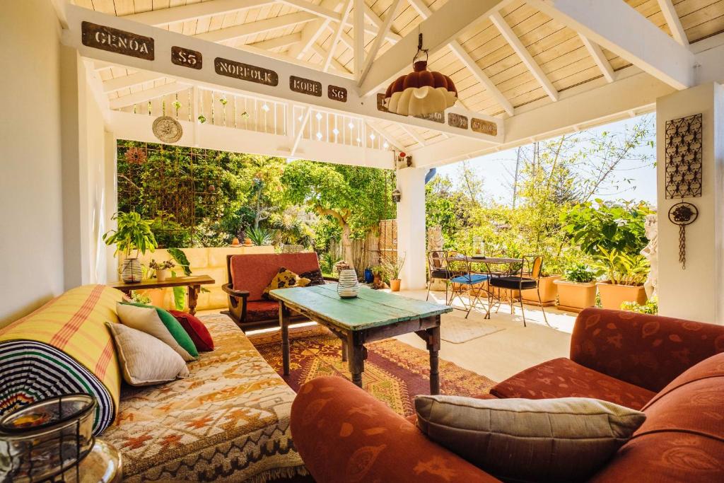 a living room with a couch and a table at The Blue Beach House in Quinns Rocks