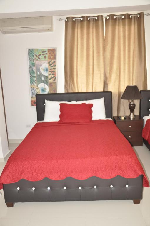 Postel nebo postele na pokoji v ubytování Sams Hotel