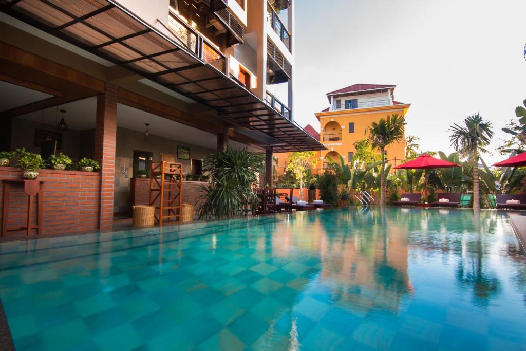 a swimming pool in the middle of a building at BB Angkor Residence in Siem Reap