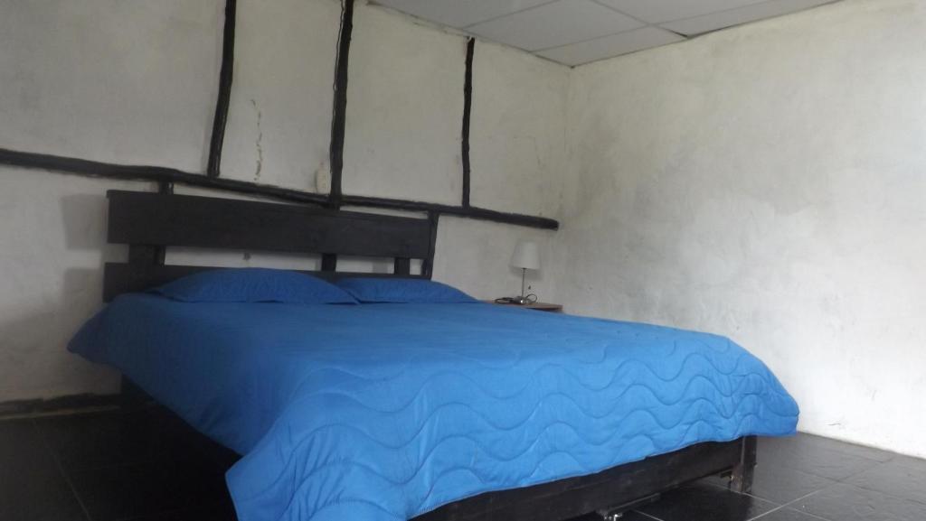 Postel nebo postele na pokoji v ubytování Finca Hotel Paraiso Urrao