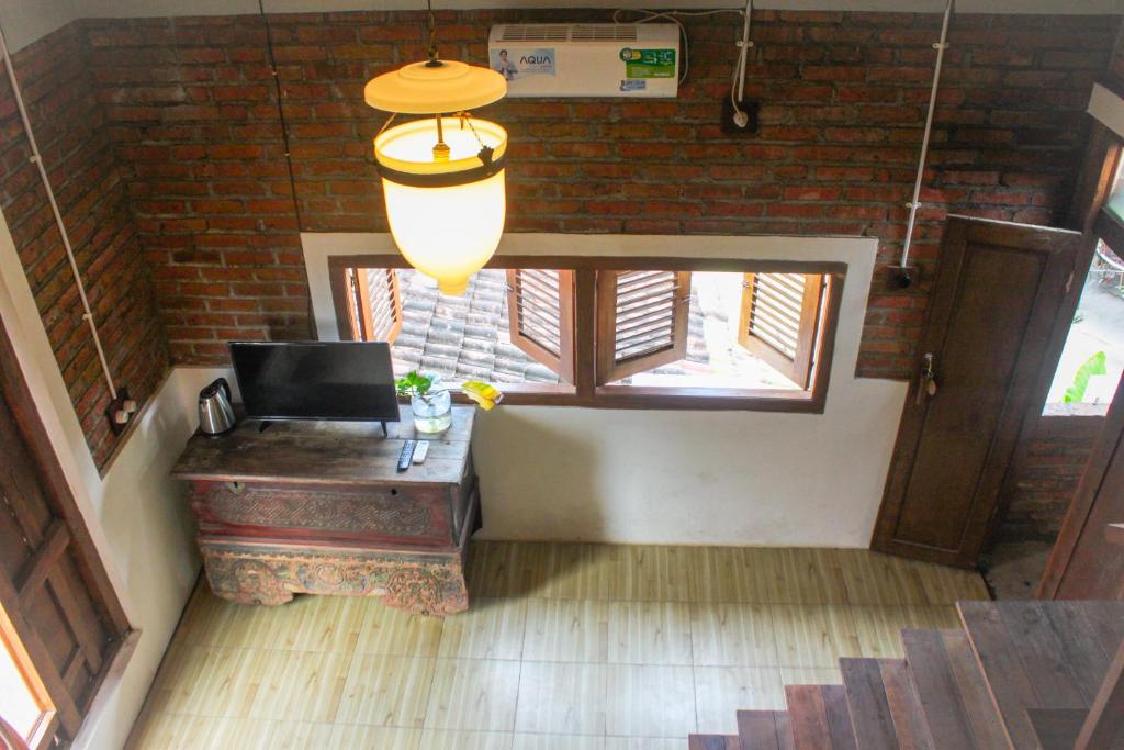 Fotografie z fotogalerie ubytování Griya Gribig Guest House Mitra RedDoorz v destinaci Malang