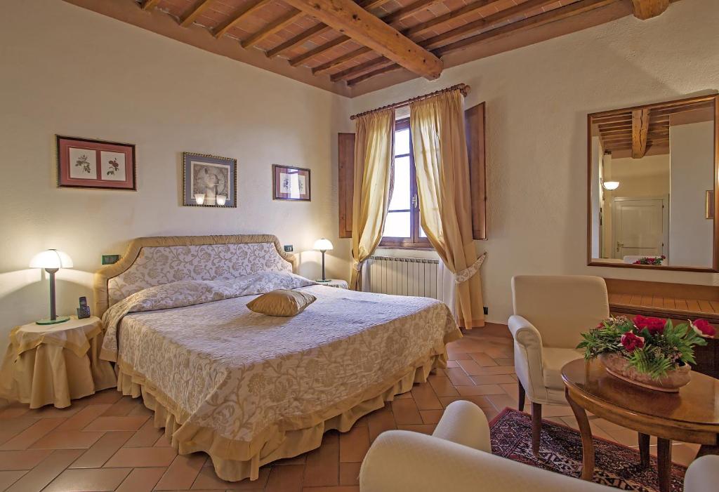 Postel nebo postele na pokoji v ubytování Relais Il Chiostro Di Pienza