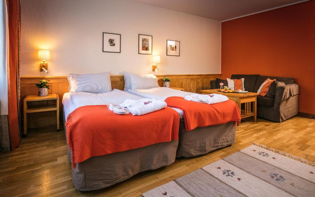 Кровать или кровати в номере Storhogna Högfjällshotell & Spa
