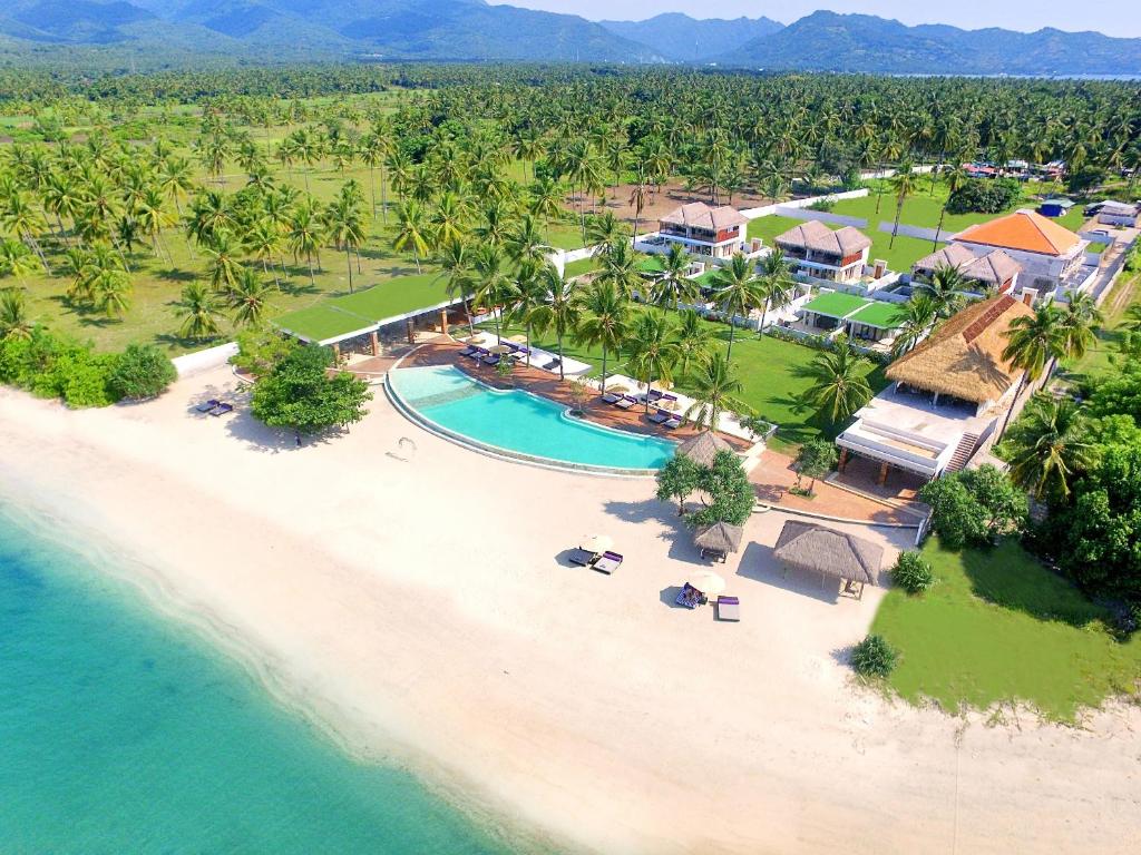 an aerial view of a beach with a resort at Anema Wellness & Resort Gili Lombok - Diving Center PADI in Tanjung