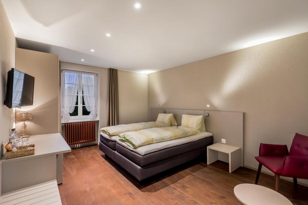 Postel nebo postele na pokoji v ubytování Hotel Gasthaus Hirschen