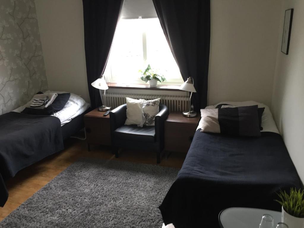 Postel nebo postele na pokoji v ubytování Höjdens Lågprishotell