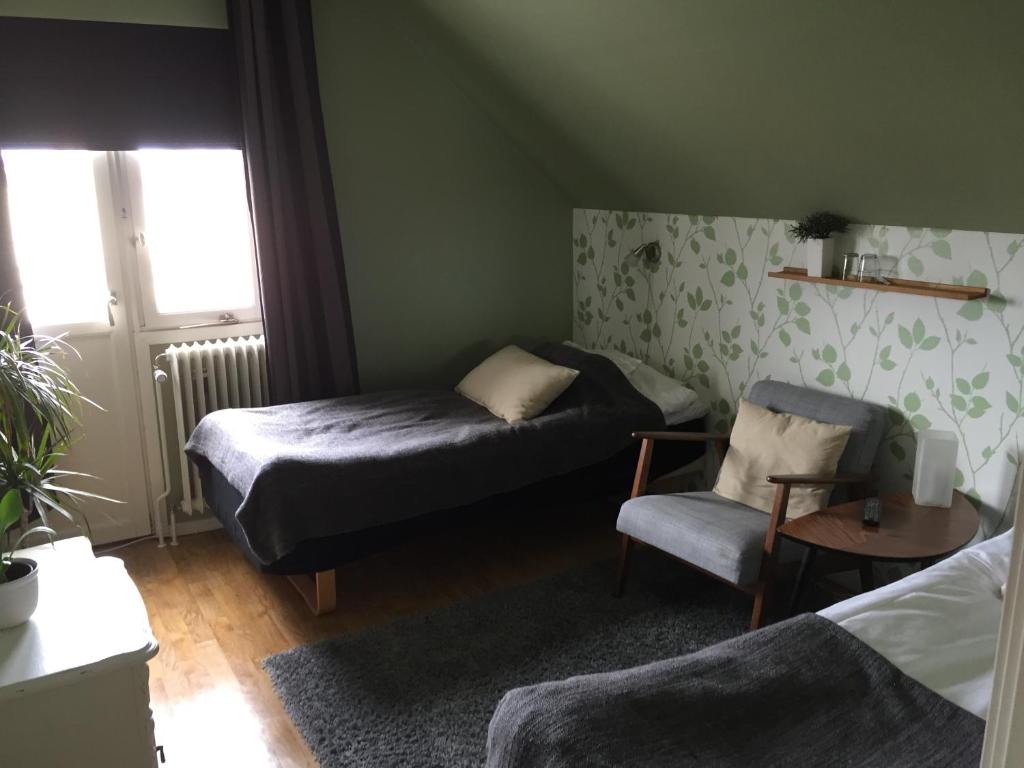 Postel nebo postele na pokoji v ubytování Höjdens Lågprishotell