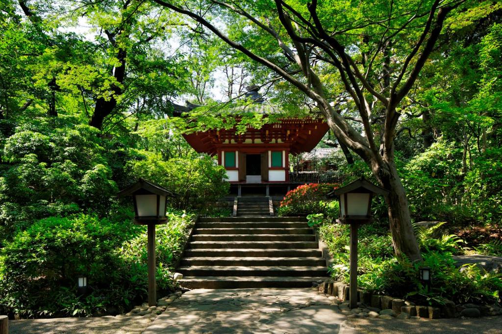 a path leading to a temple in a park at Grand Prince Hotel Takanawa in Tokyo