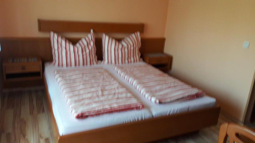 Postel nebo postele na pokoji v ubytování Arkadenhaus Steiner