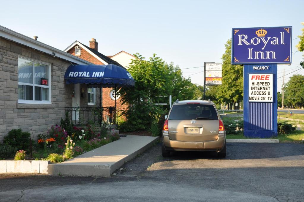 a minivan parked in front of a royal inn at Royal Inn in Burlington