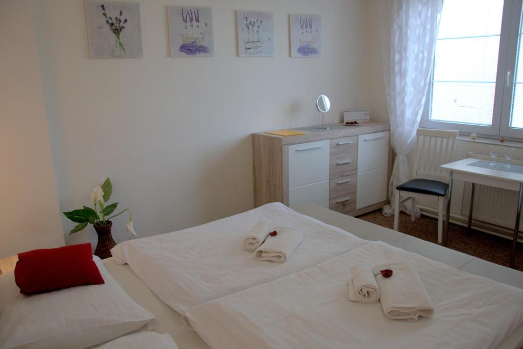 Postel nebo postele na pokoji v ubytování Hotel Gregor