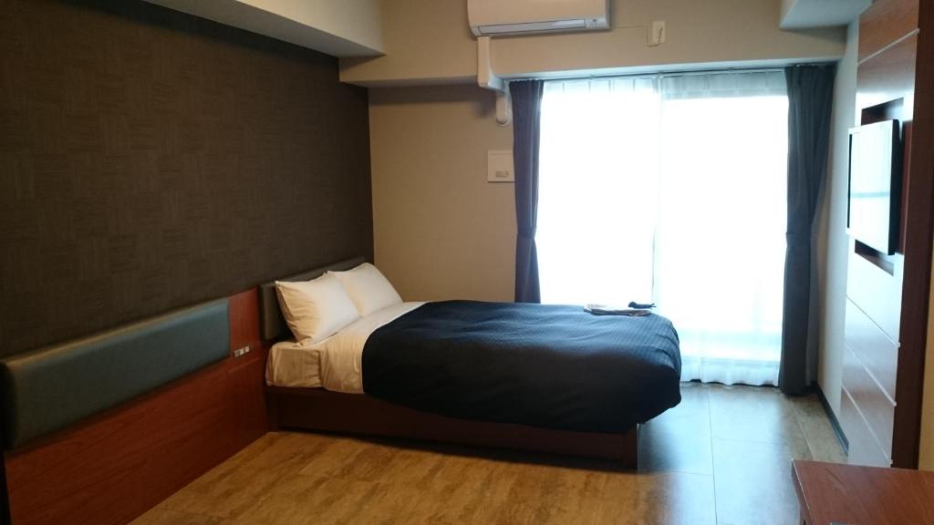 Postel nebo postele na pokoji v ubytování Hotel Trad