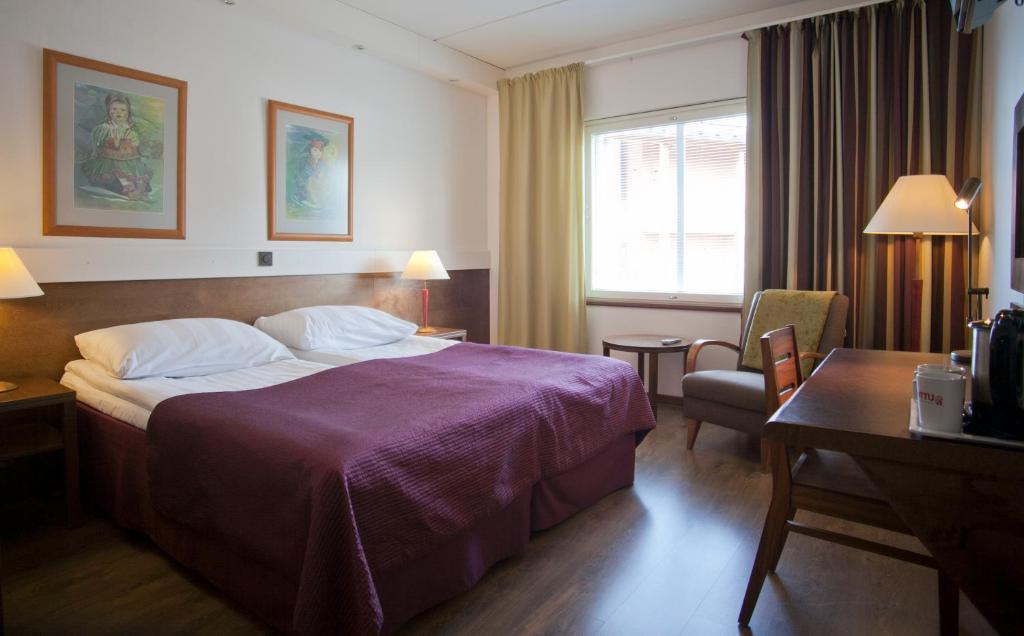 Postel nebo postele na pokoji v ubytování Hotel Inari