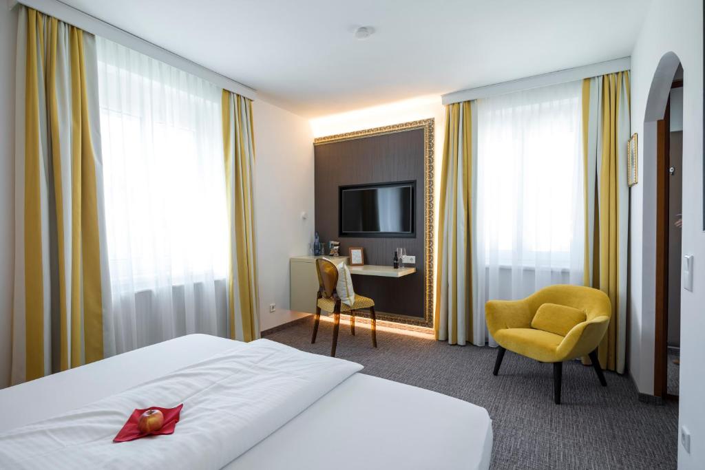 Postel nebo postele na pokoji v ubytování Hotel Goritschnigg