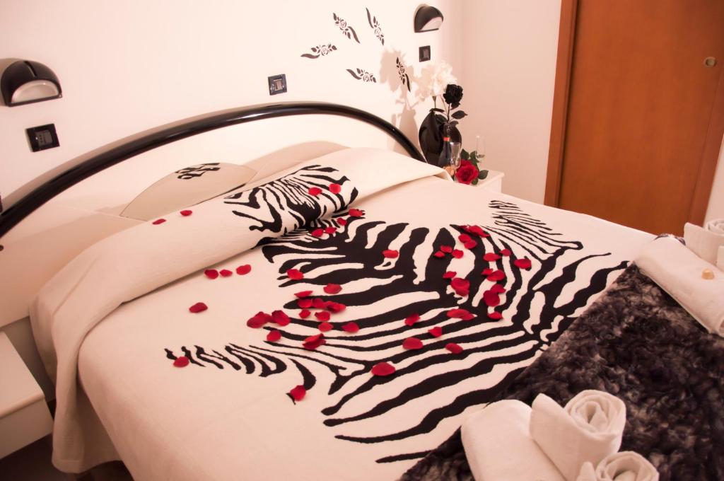 Postel nebo postele na pokoji v ubytování Hotel Beppe