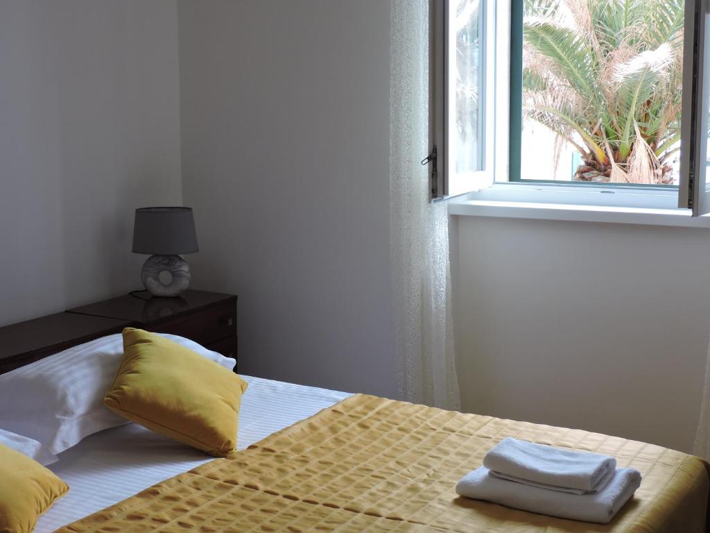 Posteľ alebo postele v izbe v ubytovaní Apartments Nina Riva