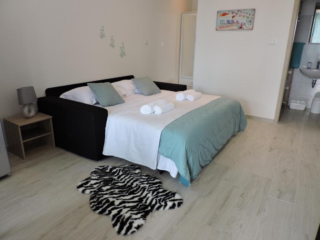 Posteľ alebo postele v izbe v ubytovaní Apartments Nina Riva