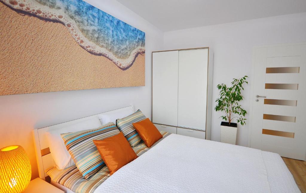 Posteľ alebo postele v izbe v ubytovaní Apartamenty REZULAK Solna B104 204 303