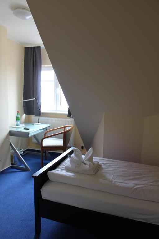 Postel nebo postele na pokoji v ubytování Kur- und Ferienhotel Sanddorn