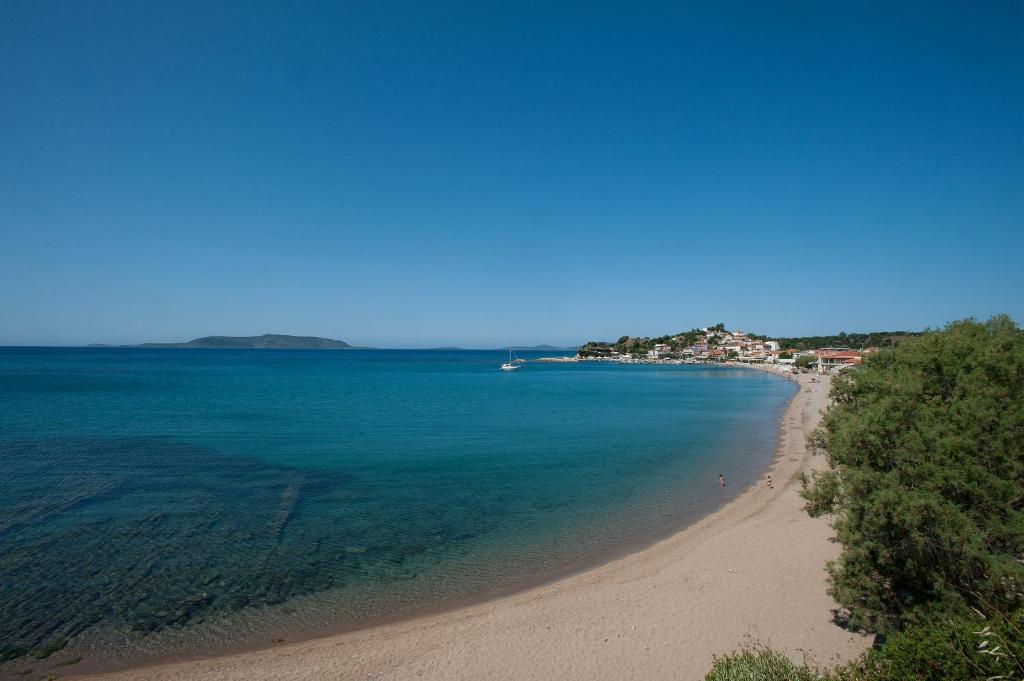 a view of a beach with people in the water at Hotel Korakakis Beach in Finikounta
