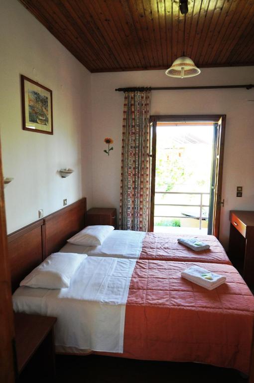 Postel nebo postele na pokoji v ubytování HYGGE Corfu