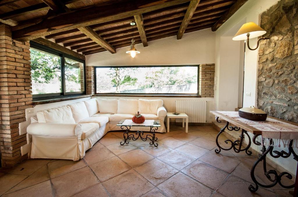 a living room with a couch and a table at Borgo Santa Cristina in Castel Giorgio