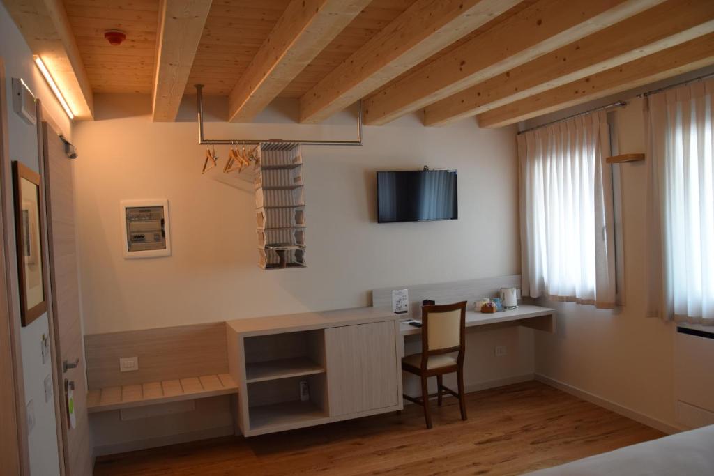 TV a/nebo společenská místnost v ubytování Residenza Ai Capitelli