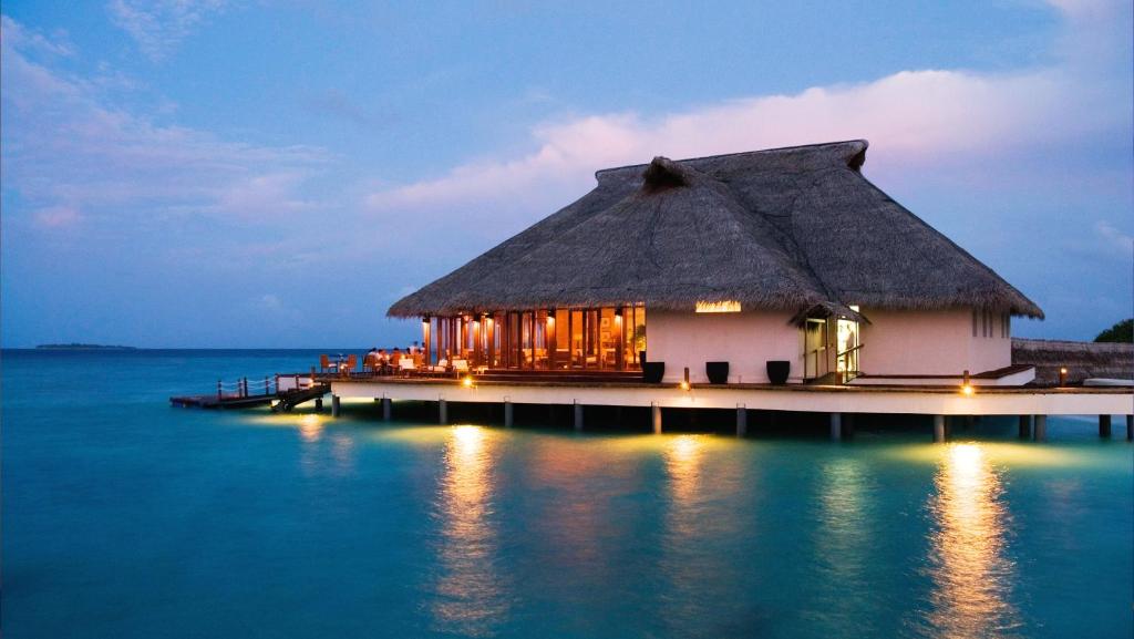 a house on a pier in the middle of the water at Adaaran Prestige Water Villas - with Dine around Premium All inclusive - 24 hours in Raa Atoll